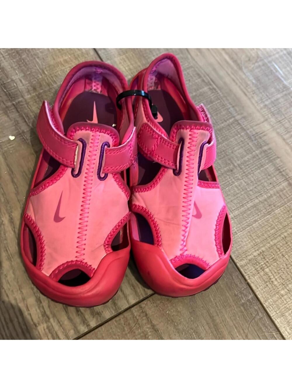 Pink and purple Nike water shoes